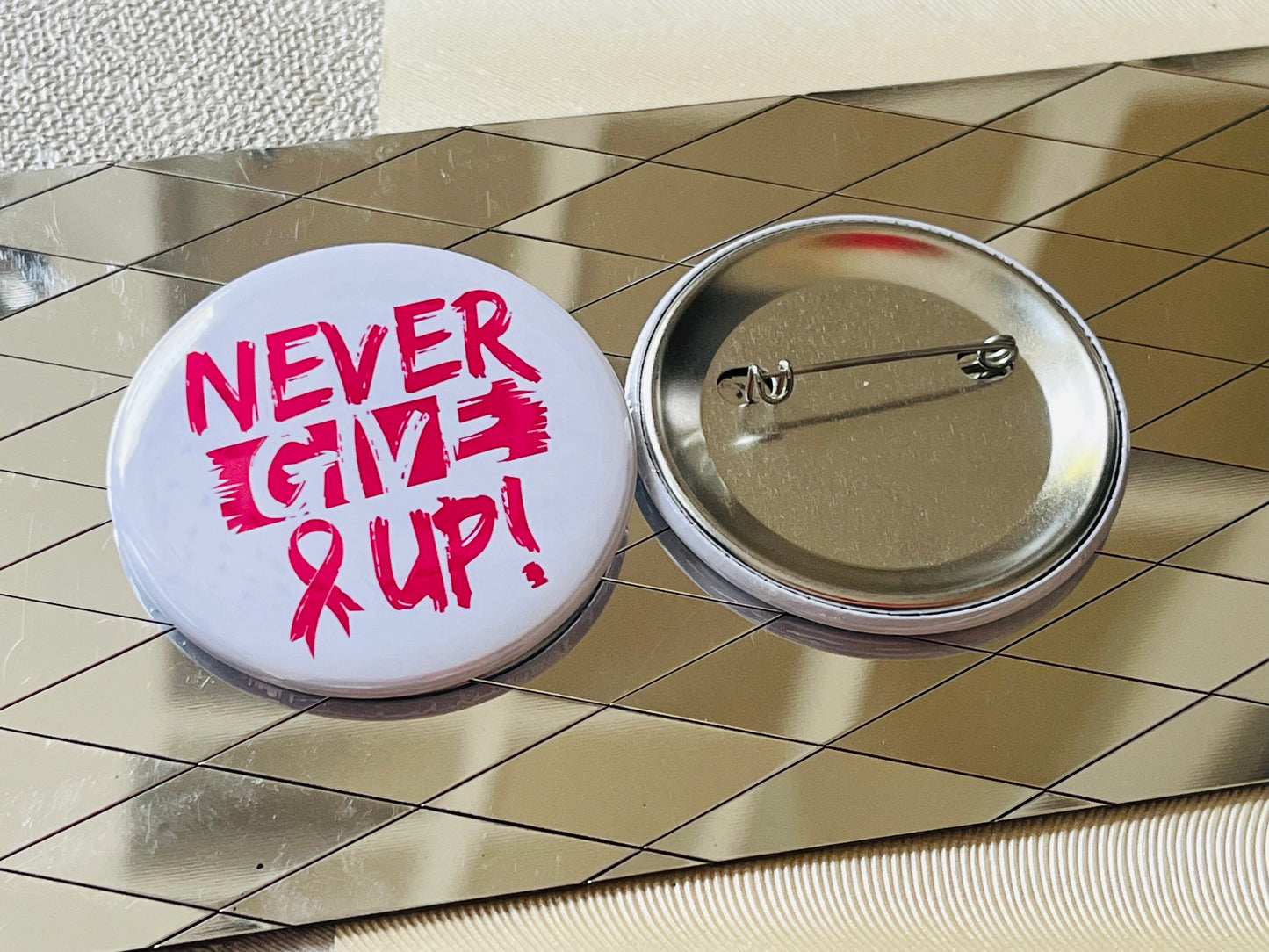NEVER GIVE UP - BREAST CANCER AWARENESS 2.25" PINBACK BUTTON